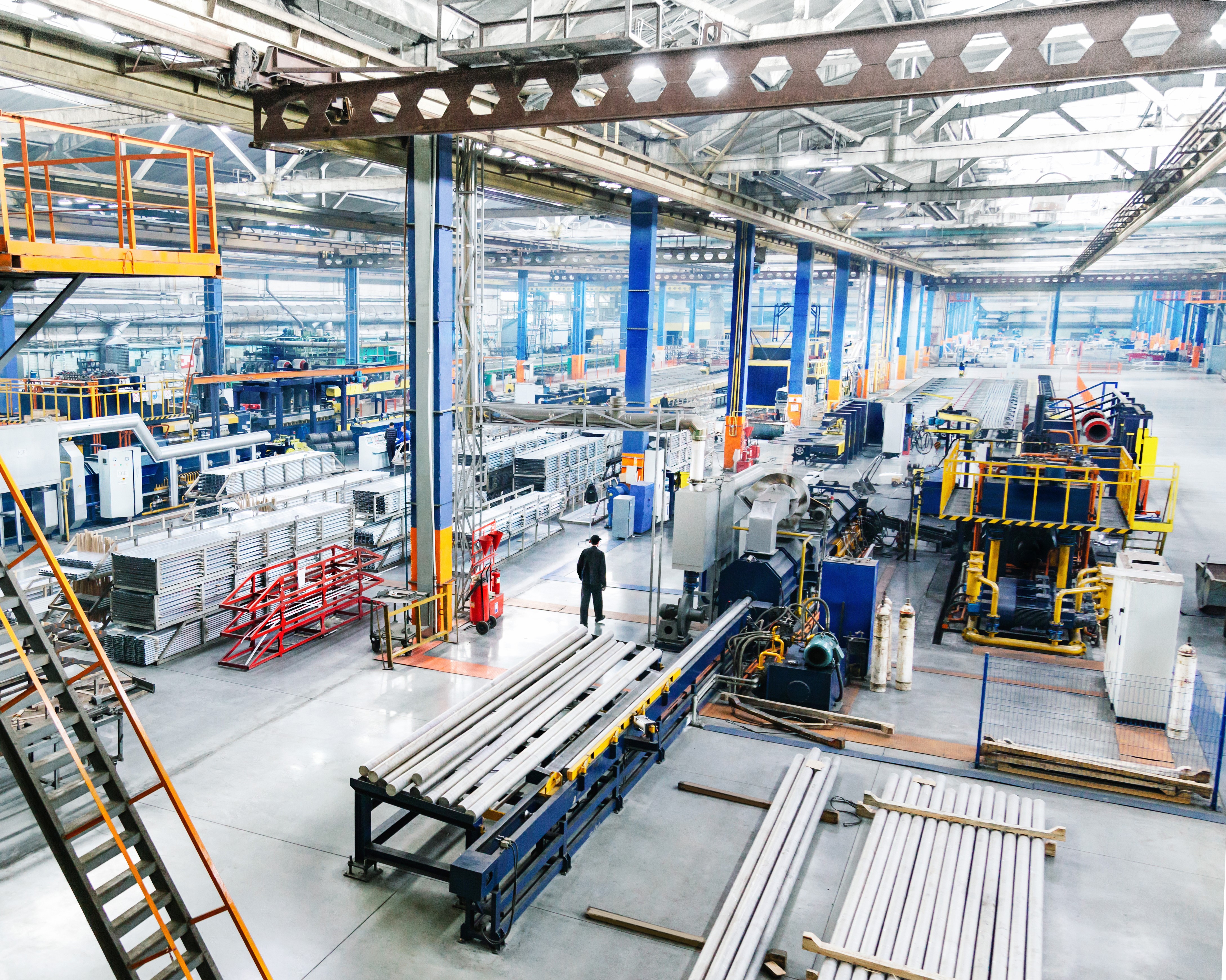 An overview of a large factory with various machines around the site.